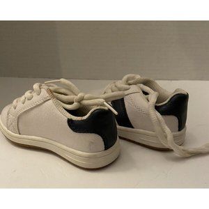 Place baby white and black sneaker shoes size 5